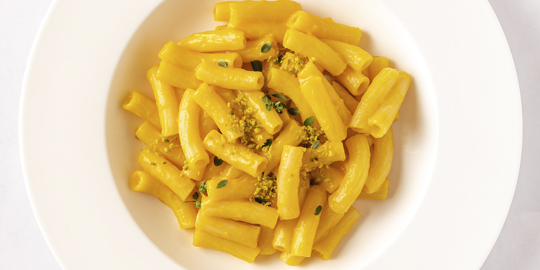 White Corn Maccheroni with Yellow Peppers, Pistachios and Marjoram